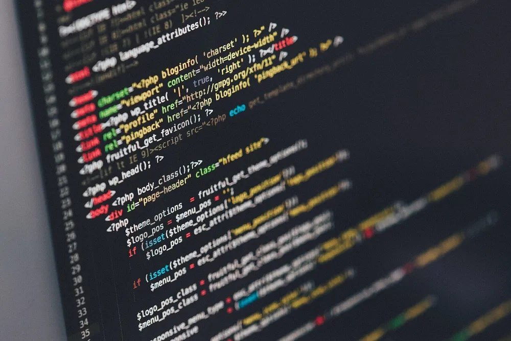 Colourful lines of source code in a dark code editor